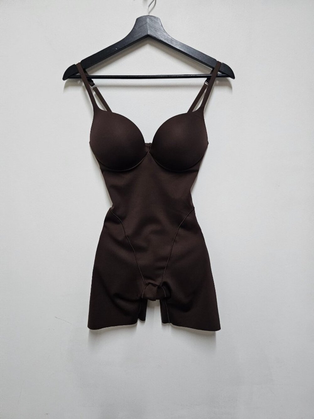 SKIMS Seamless Sculpt Mid Thigh Bodysuit in the color Cocoa, featuring built-in